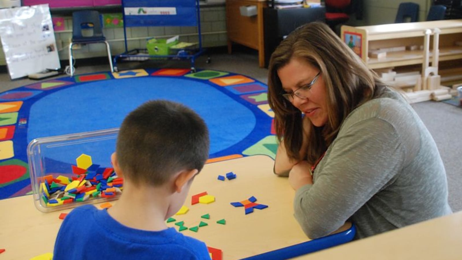 Brandy Barhite works with a preschool student at Beach Court Elementary.