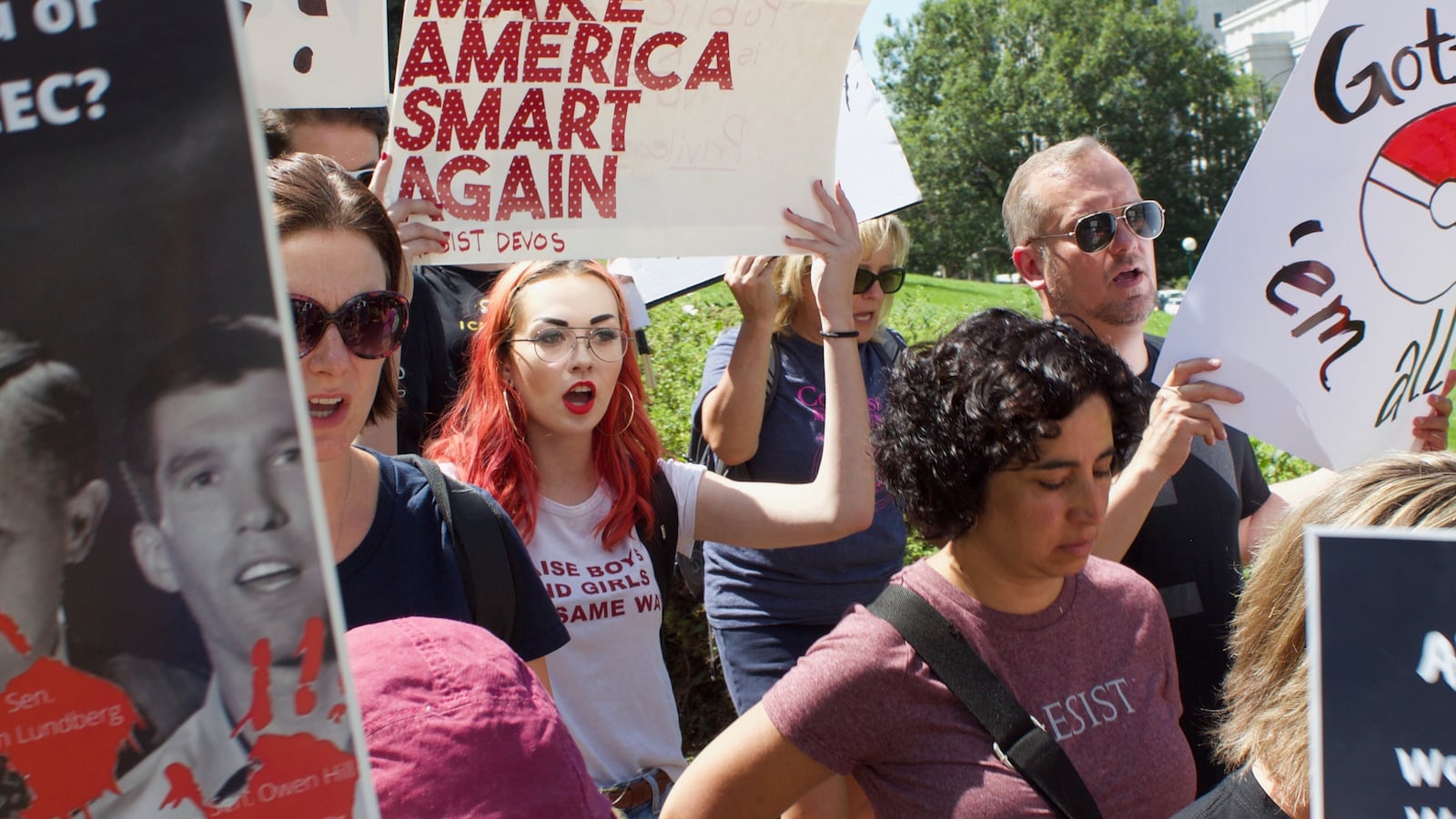 Protestors march from the Capitol to the Hyatt Regency Denver, where ALEC is holding their annual meeting. (Photos by Marissa Page/Chalkbeat)