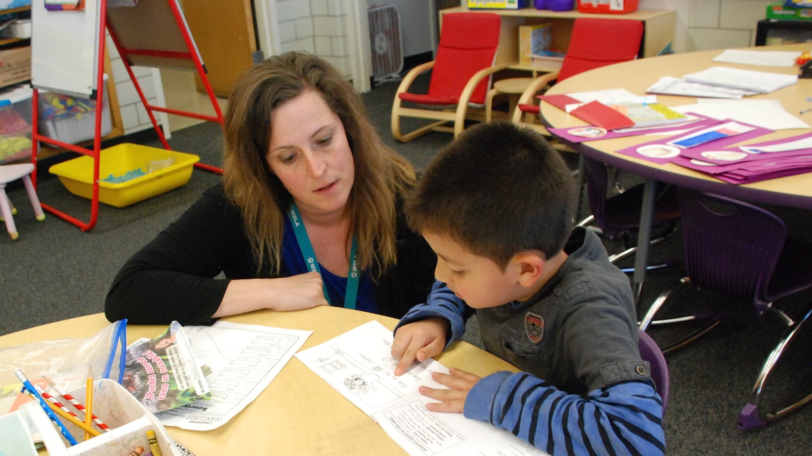 Kim Ursetta works with a student in her classroom at Denver's Mathematics and Science Leadership Academy.