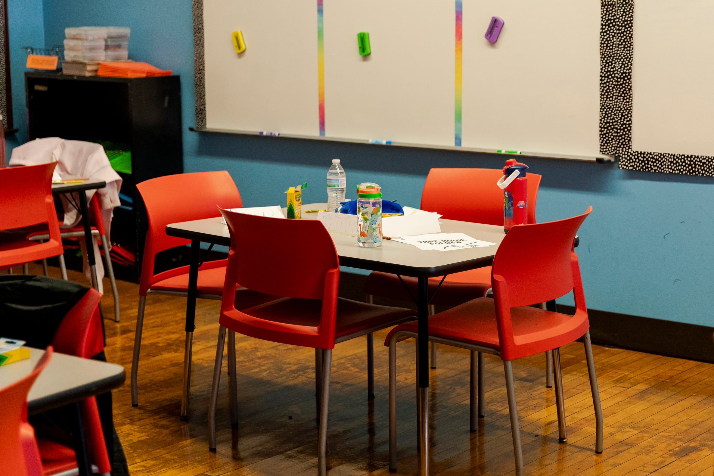 An empty classroom showing a few desks in an elementary school.