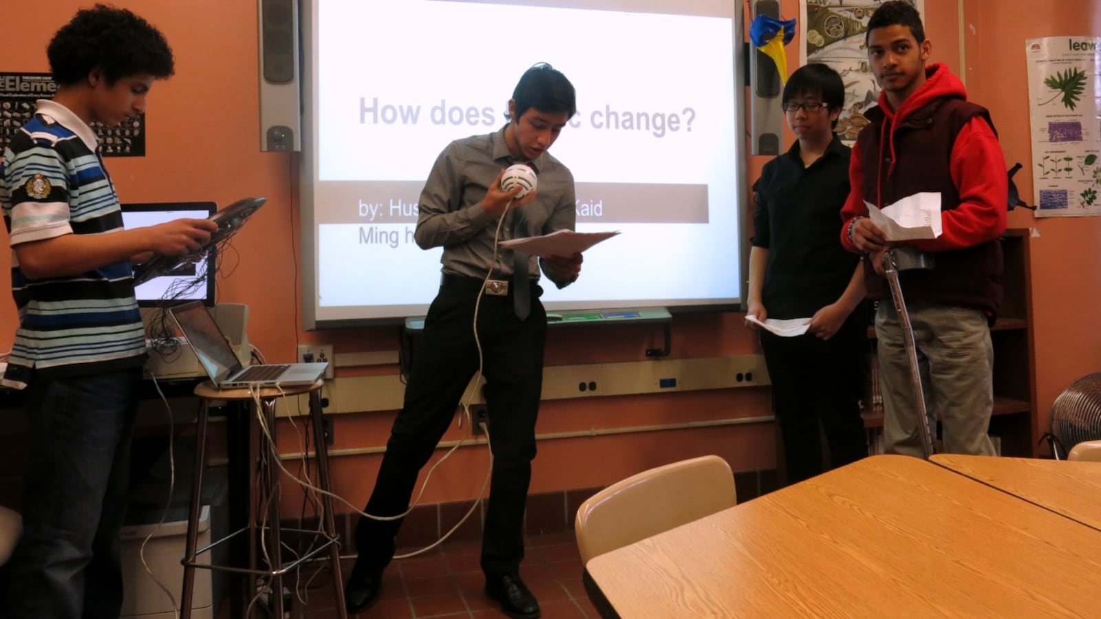 Brooklyn International High School students perform a song using an instrument they made from a clock.