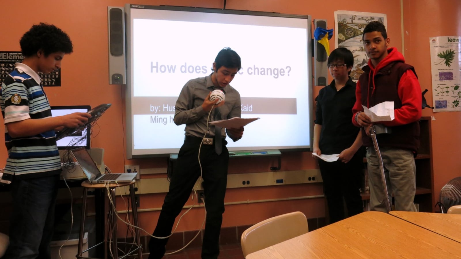 Brooklyn International High School students perform a song using an instrument they made from a clock.