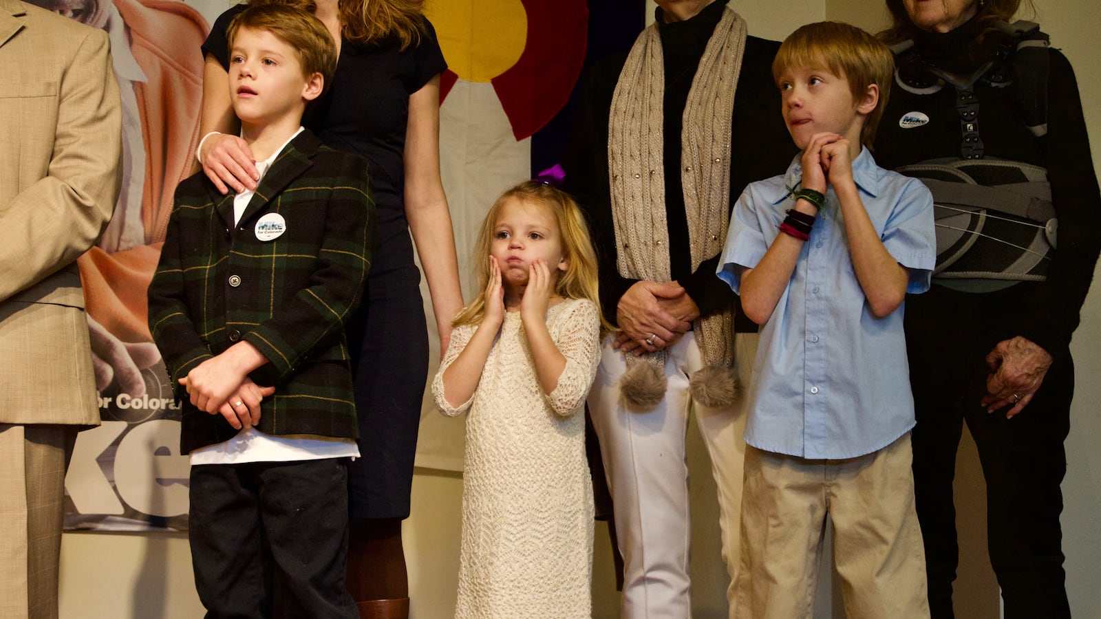 Former state Sen. Michael Johnston’s children listen to him announce his gubernatorial bid.