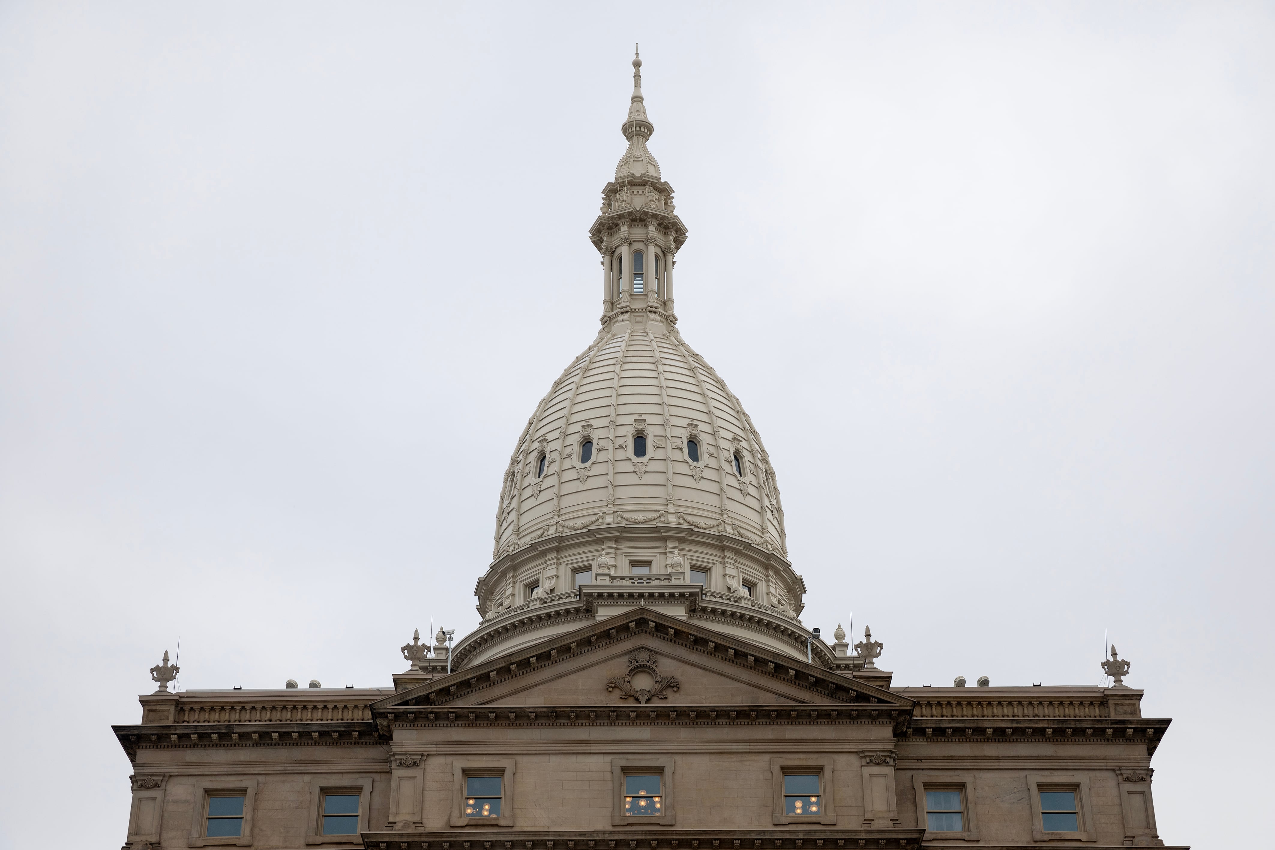 A large stone Capitol building on a cold, cloudy day.