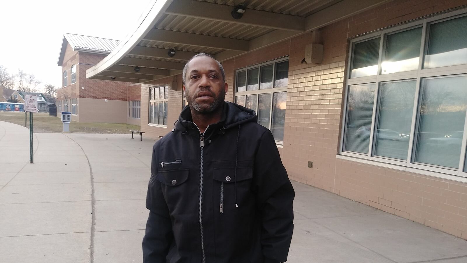 Warren Cunningham is picking up meals for his three children at Mackenzie Elementary-Middle School. Photo Credit: Eleanore Catolico/Chalkbeat