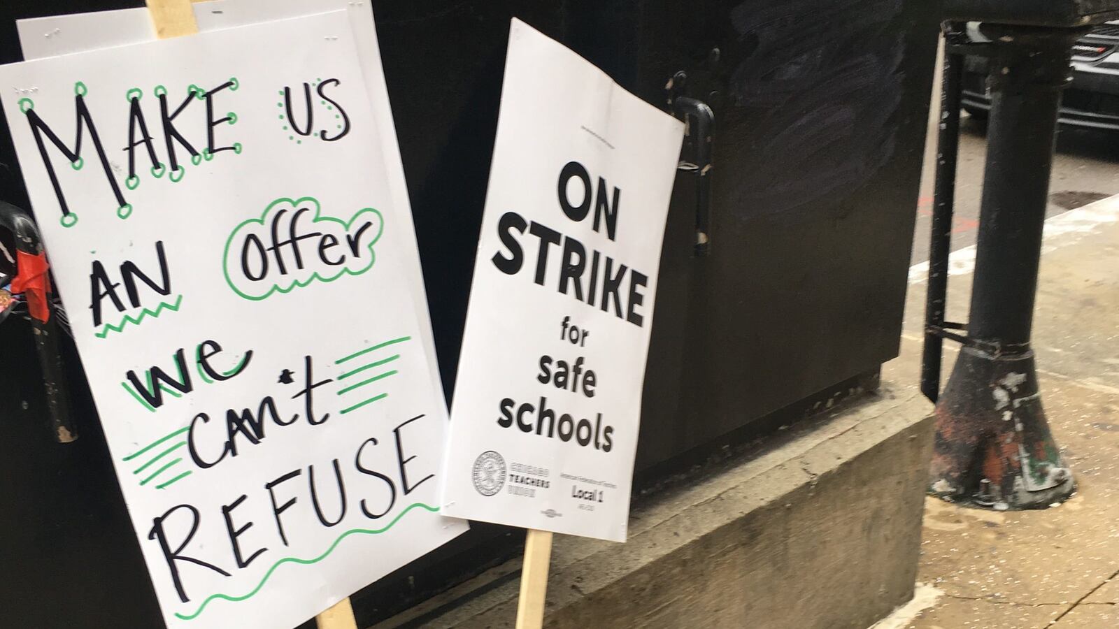 Picket signs used by protesting strikers from the Chicago International Charter Schools, who were targeting charter network CEO Elizabeth Shaw on Feb. 11, 2019.