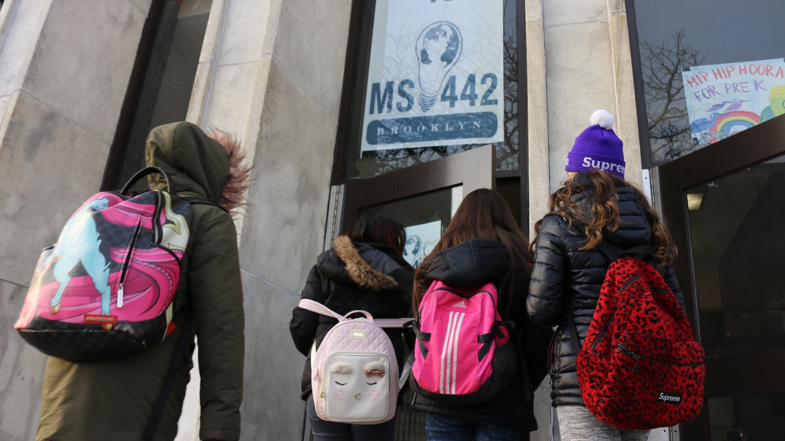 Students start the school day at M.S. 442 in District 15. The school lost federal Title I funding after the number of needy students enrolled there declined, an issue that more schools in the district could face now that an integration plan is in place.