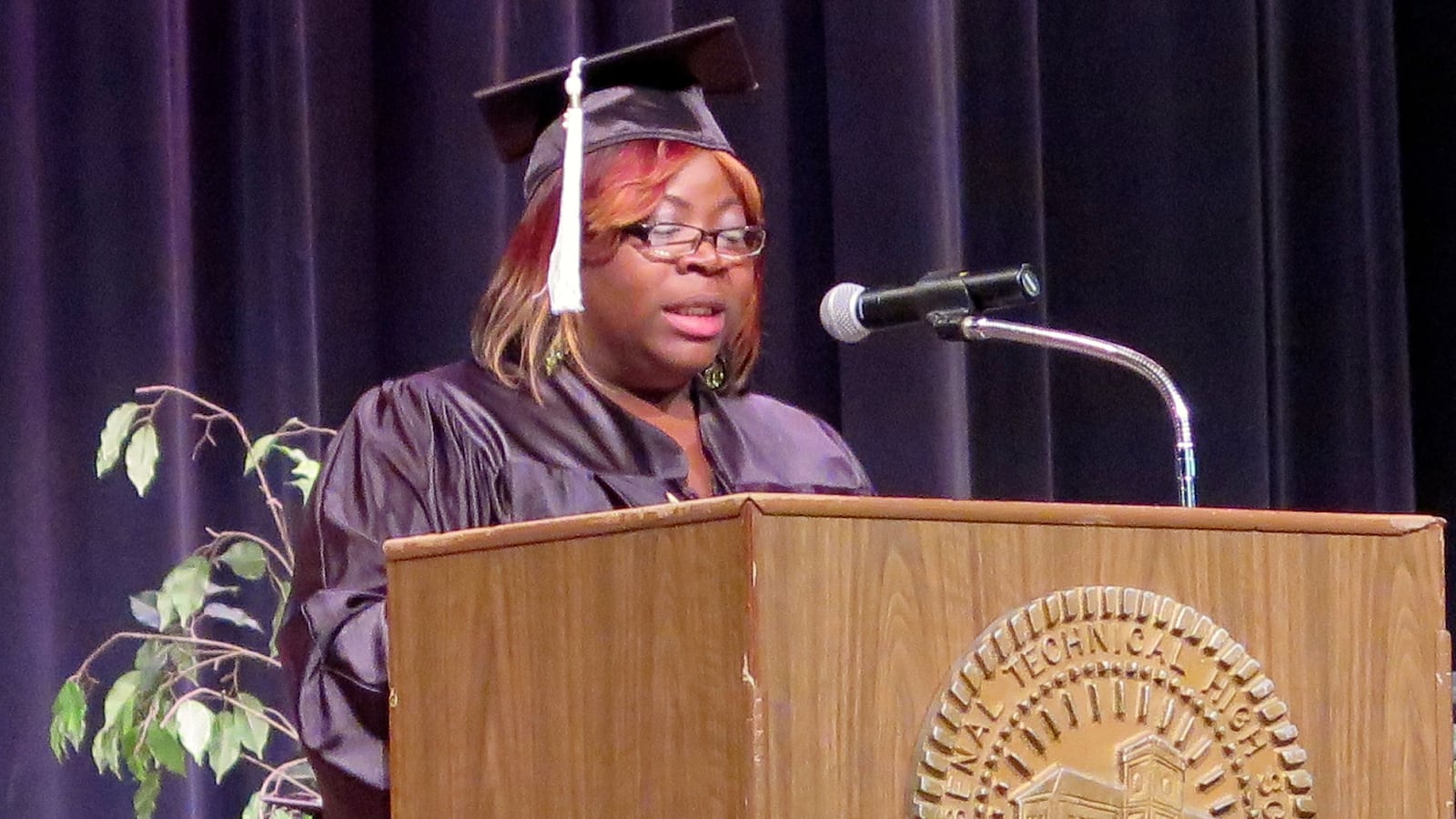 Carmellia Fleming gives a graduation speech at Indianapolis Public Schools' adult basic education ceremony. The district's programs will soon be taken over by nearby townships.
