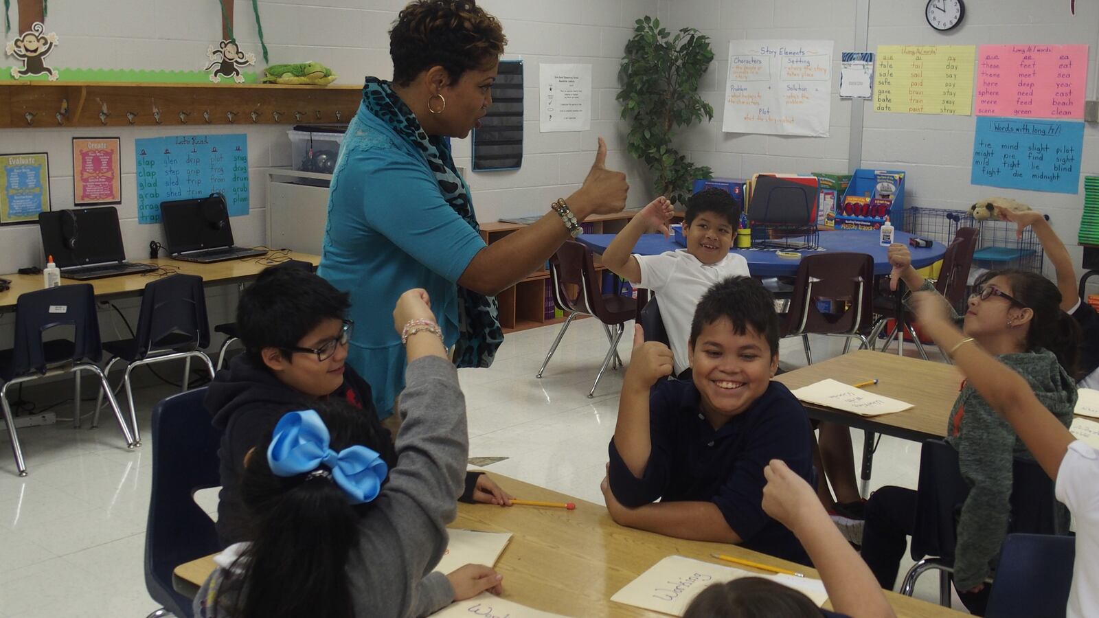 Tanya Hill, an ESL teacher at Kate Bond Elementary School in Memphis, tells her students to respond to a question with a thumbs up or down.