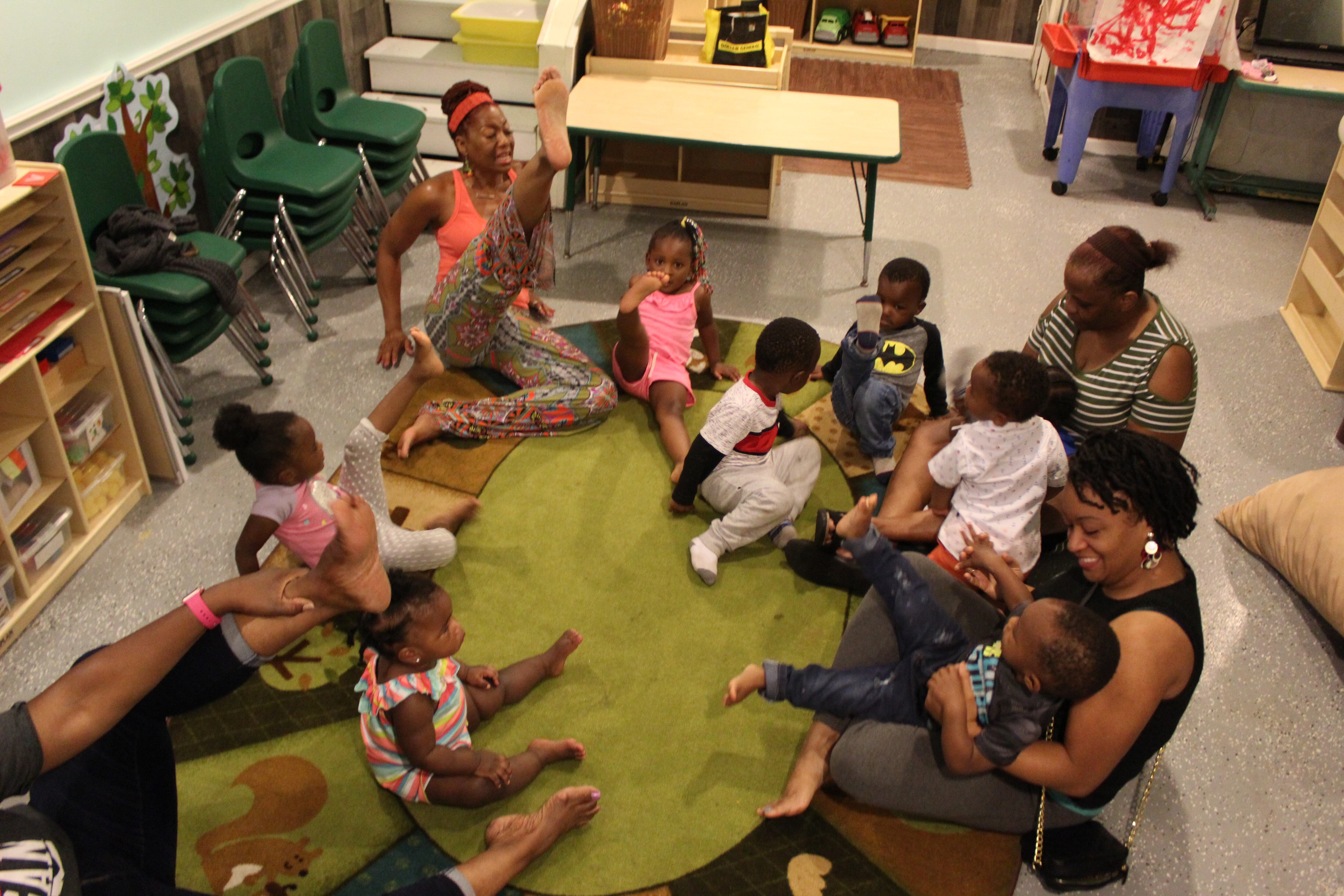 Students at Jill’s Creative Learning practice body movements while singing.