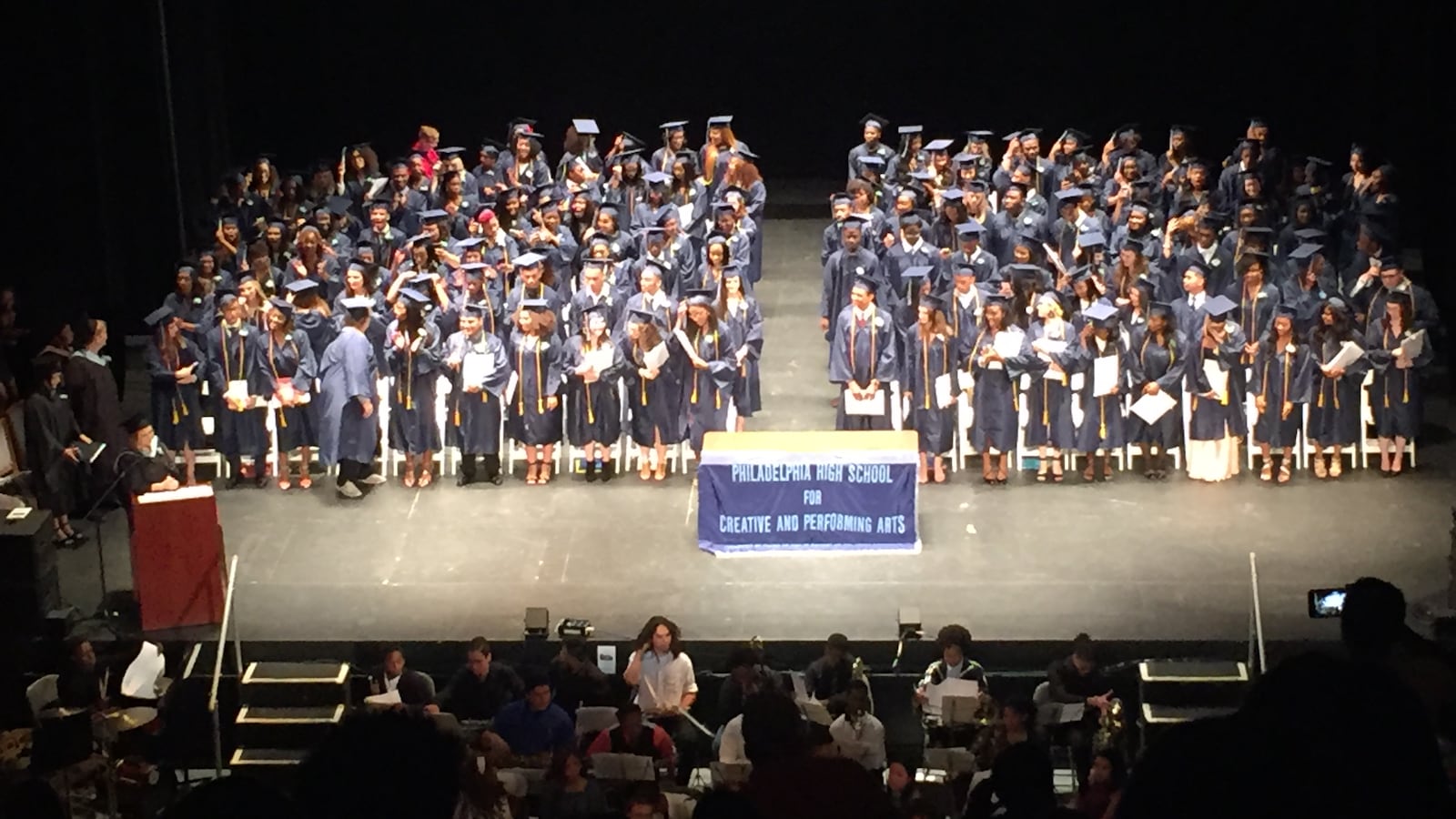 Students on stage at the CAPA graduation. 