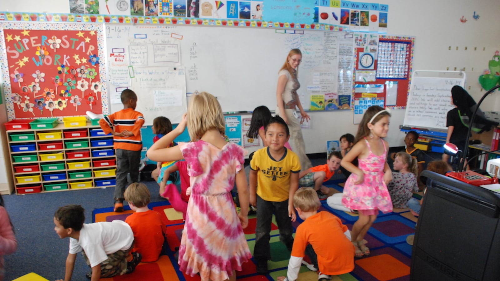 Students move about a classroom at the Denver Green School.