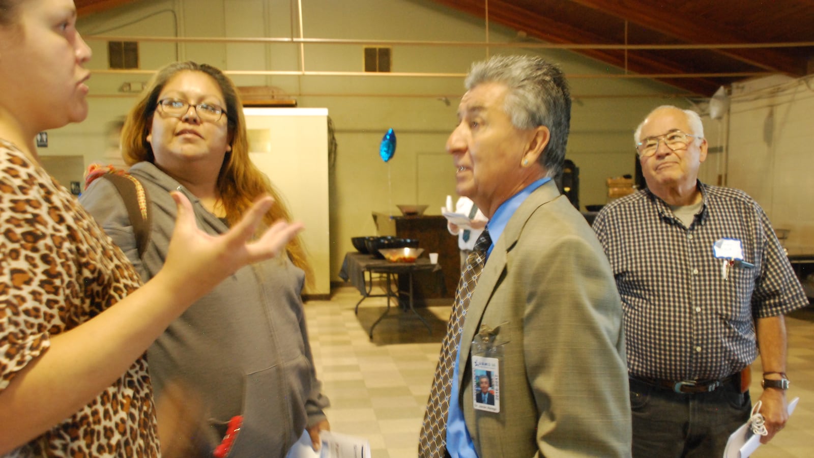 Javier Abrego, Adams 14 superintendent, center, speaks with parents after a forum in September 2016.
