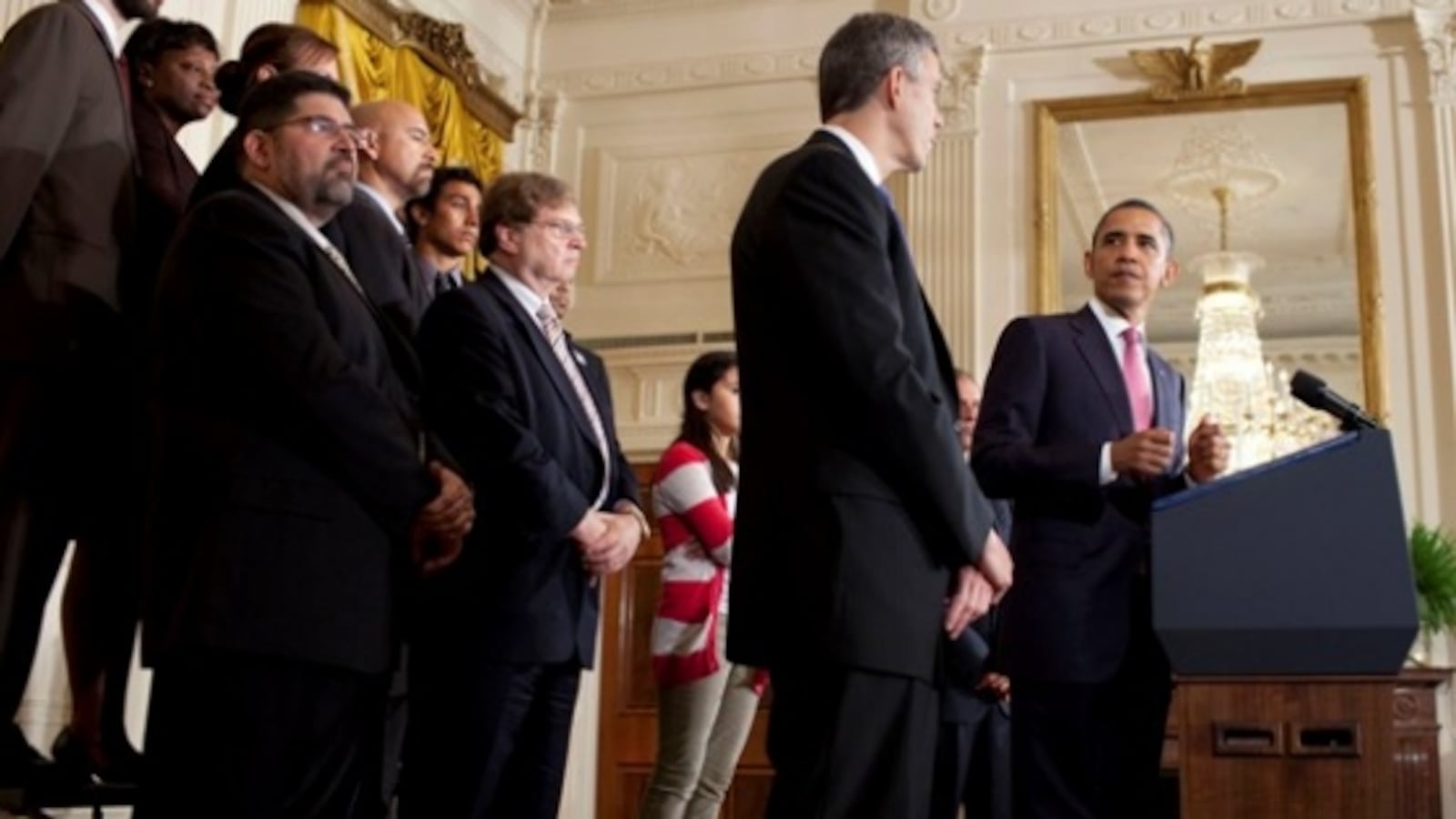 President Barack Obama looks towards U.S. Education Secretary Arne Duncan during remarks in 2011.