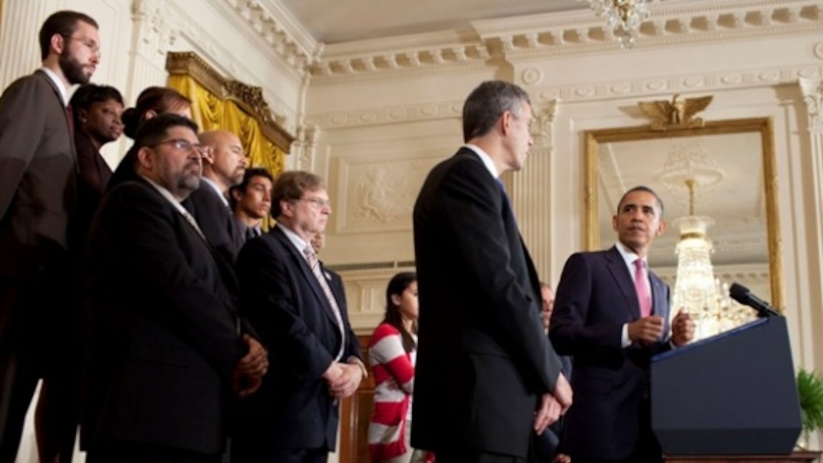 President Barack Obama looks towards U.S. Education Secretary Arne Duncan during remarks in 2011.