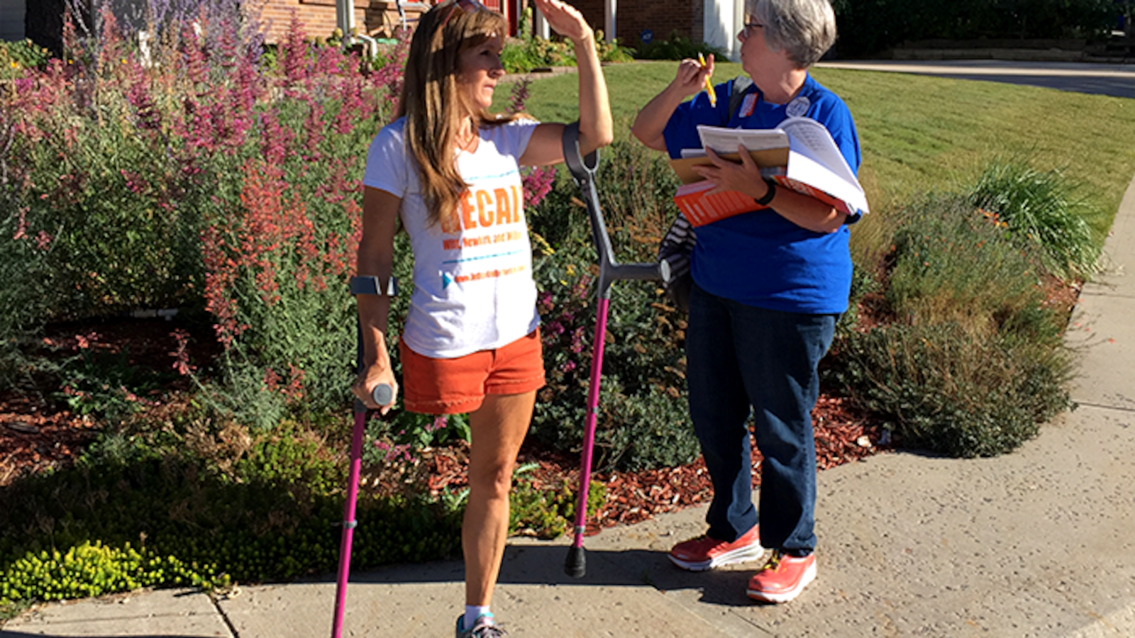 Jeffco United volunteers Annie Bitsie, left, and Nancy McCanless search for their next house to canvass Sept. 19. The two were among hundreds of volunteers knocking on doors to support the school board recall effort in Jefferson County.