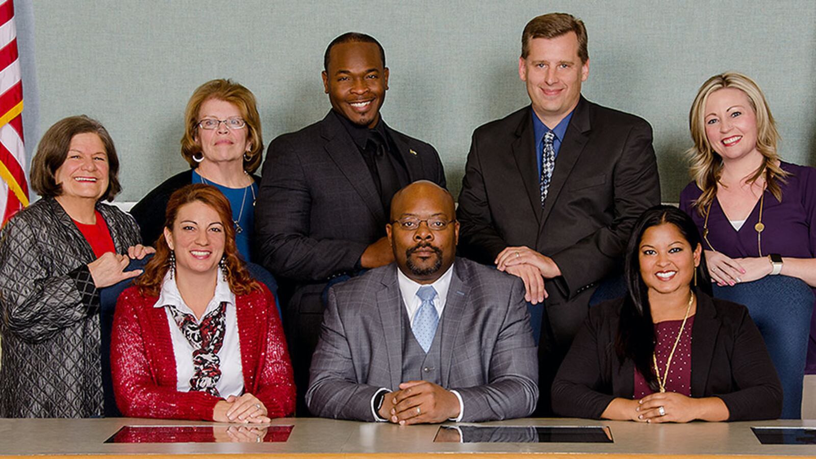 The Aurora school board poses with Superintendent Rico Munn. Eric Nelson is third from the left in the top row. Amber Drevon is first on the left in the bottom row.