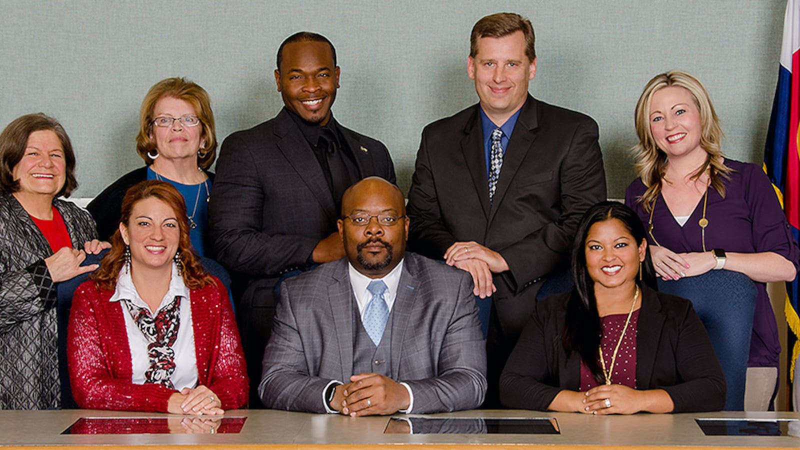 The Aurora school board poses with Superintendent Rico Munn. Eric Nelson is third from the left in the top row. Amber Drevon is first on the left in the bottom row.