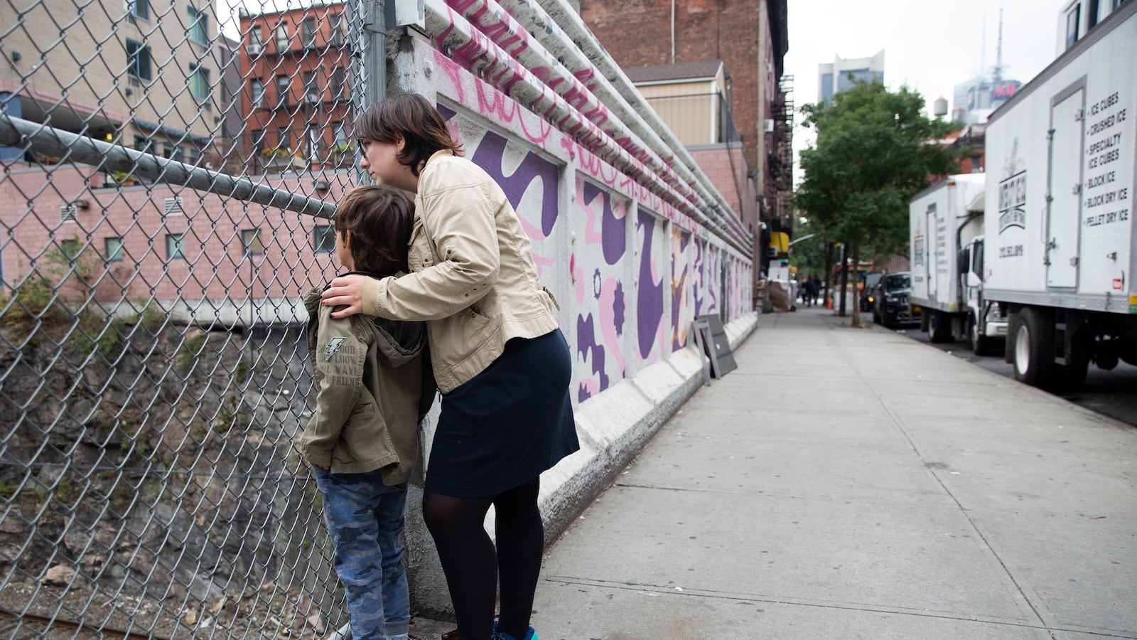 Eliyanna Kaiser and her seven-year-old son, who has autism, watch for Amtrak trains near their Hell’s Kitchen home, Oct. 14, 2019.