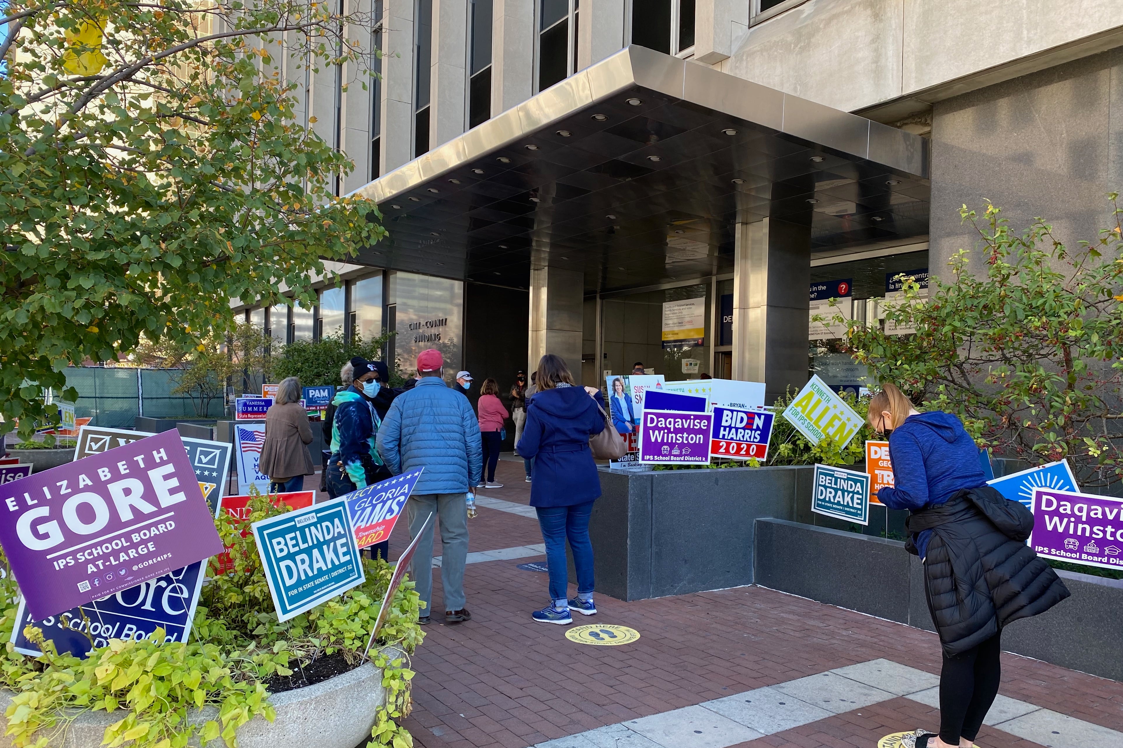Early voters wait in line outside the Indianapolis City-County Building for the 2020 election.