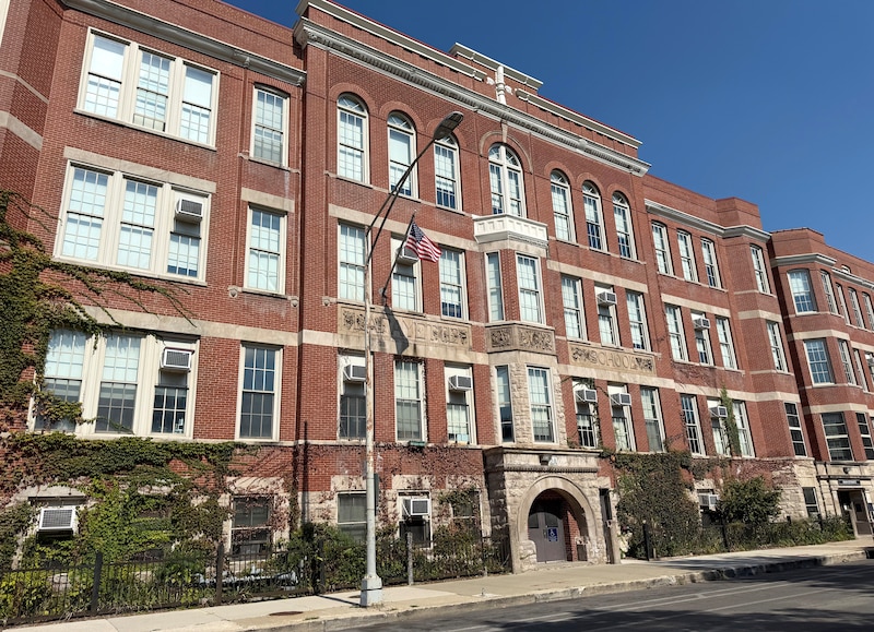 A three-story brick building.
