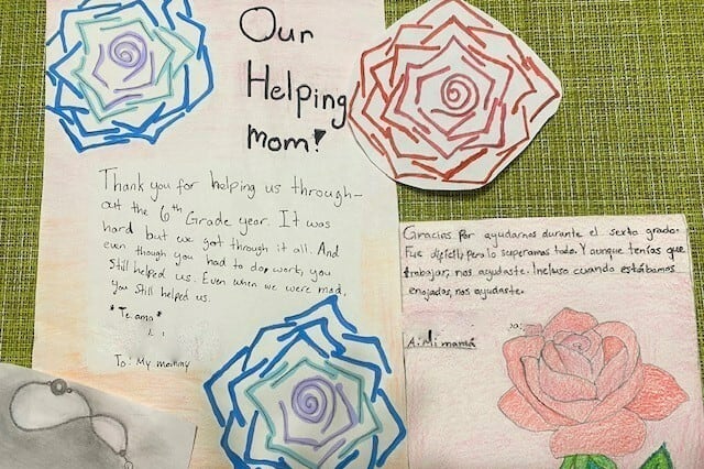 Cards with flower drawings on them titled “Our Helping Mom!” thank their mother for all of her help over their school years.