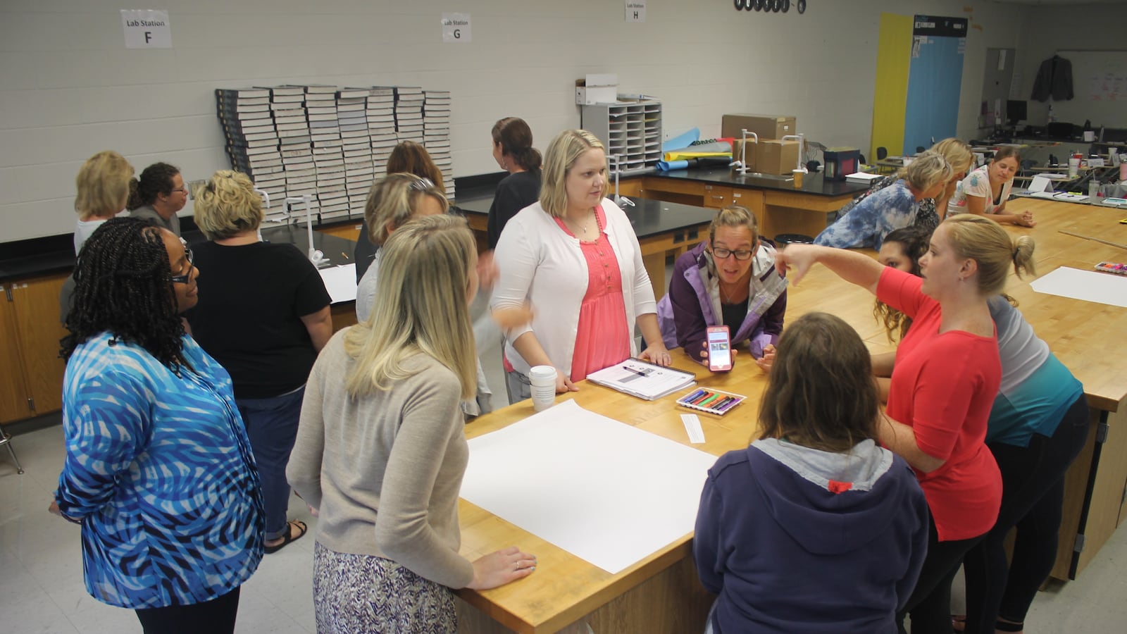 Karyn Bailey (left), a facilitator from Williamson County Schools, coaches elementary school teachers during a 2017 exercise on Tennessee’s revised standards for English language arts as part of a two-day training at La Vergne High School, one of 11 training sites across the state.