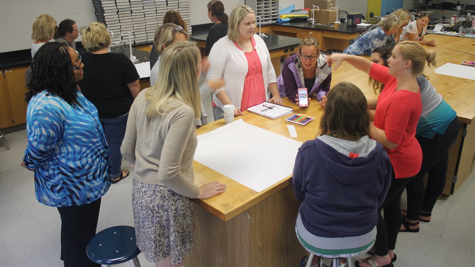 Karyn Bailey (left), a facilitator from Williamson County Schools, coaches elementary school teachers during a 2017 exercise on Tennessee’s revised standards for English language arts as part of a two-day training at La Vergne High School, one of 11 training sites across the state.