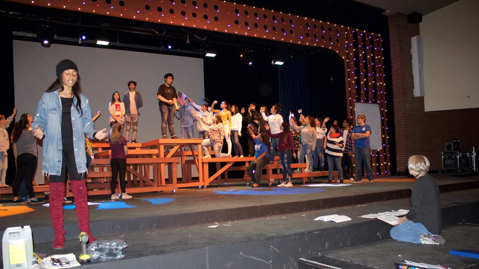 Ebony Nash, left, sings during a rehearsal of Ragtime at Hinkley High School. (Photo by Yesenia Robles, Chalkbeat)