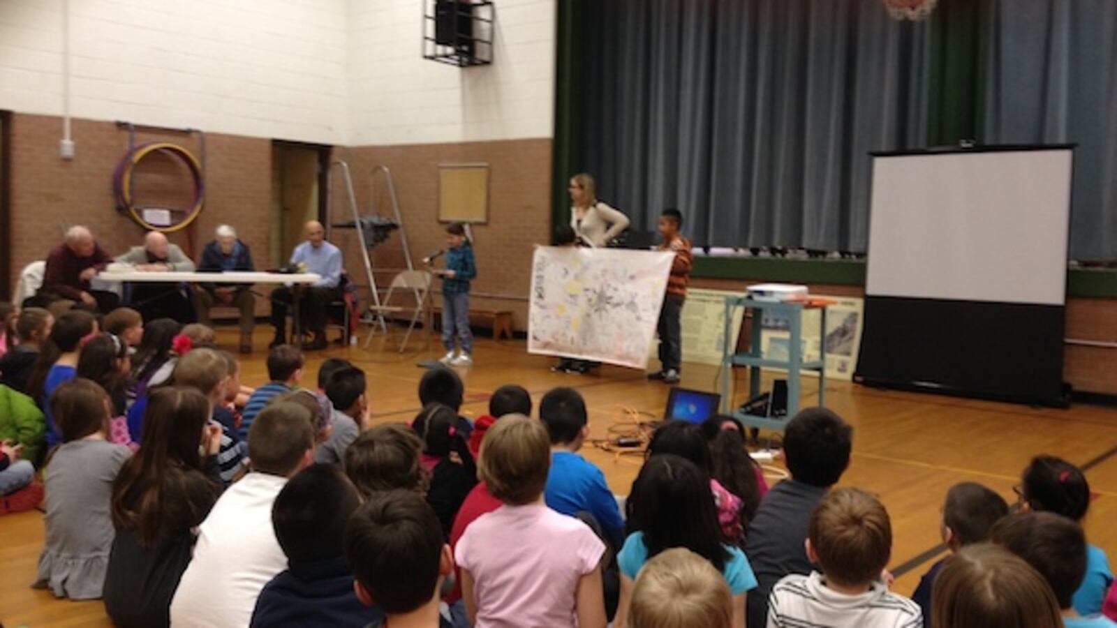 Students present to Tenth Mountain Division veterans during a third grade mini-expedition at West Park Elementary.