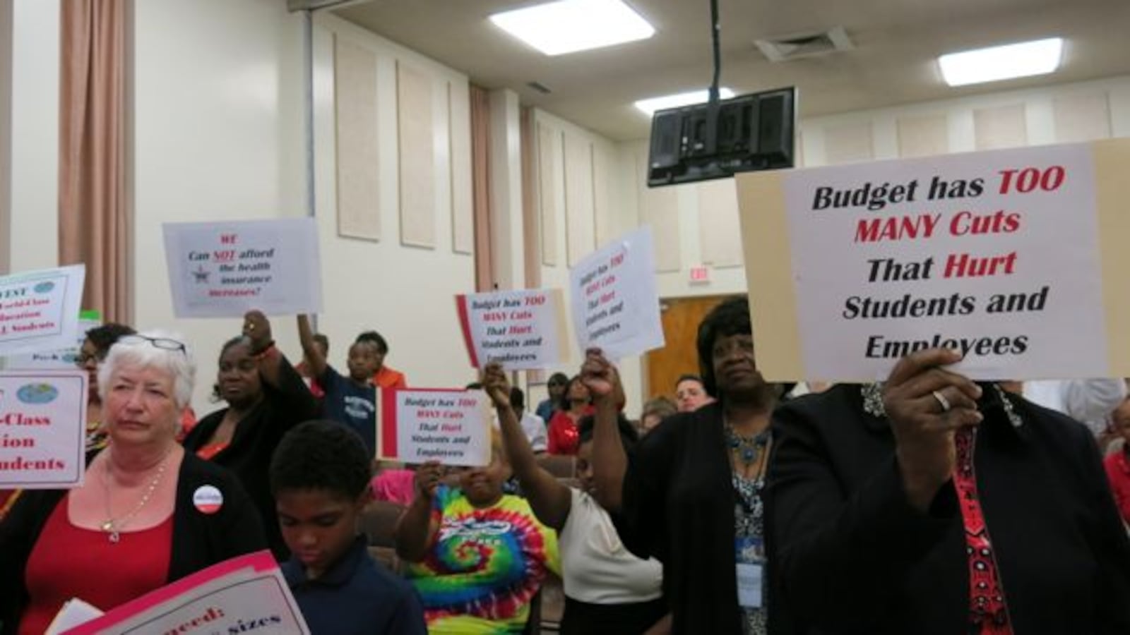 Several Shelby County School teachers protested budget cuts during Tuesday's called meeting to approve the 2014-15 budget.