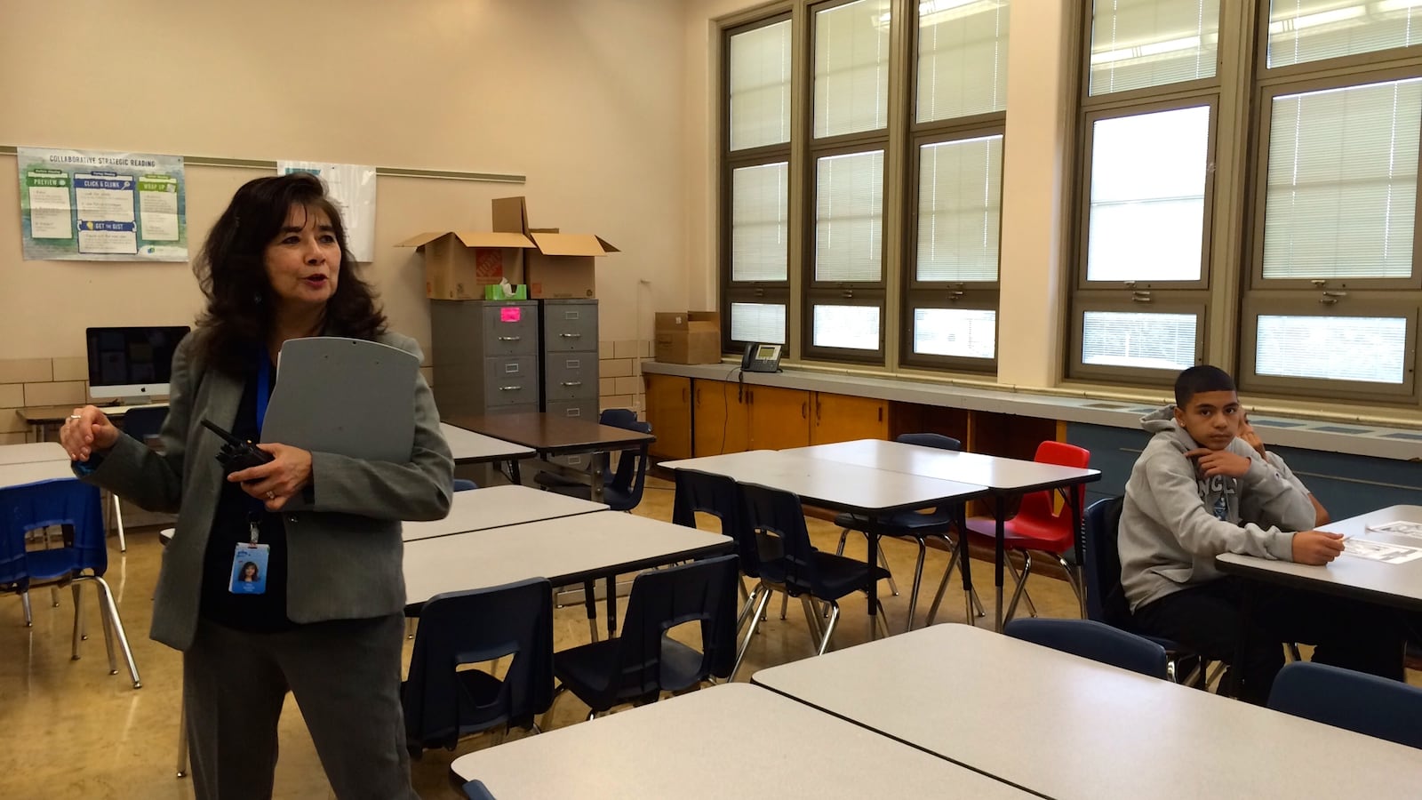 Kepner Middle School principal Elza Guajardo visits a classroom Sept. 12. The students were solving a murder mystery.