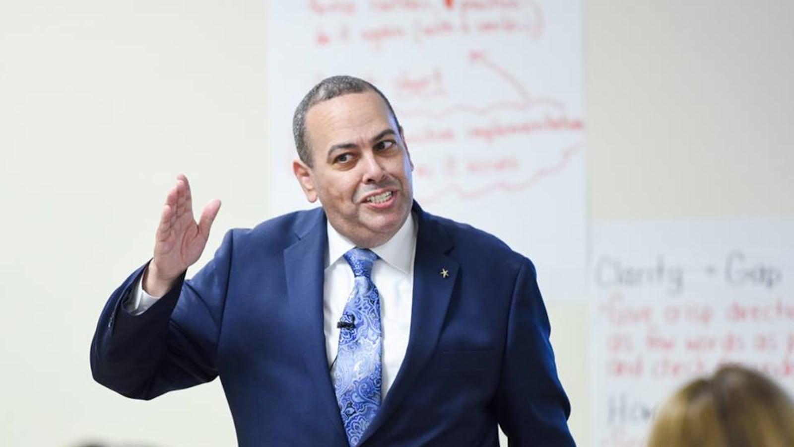 Superintendent Roger León speaking to educators at a Newark charter school last year.