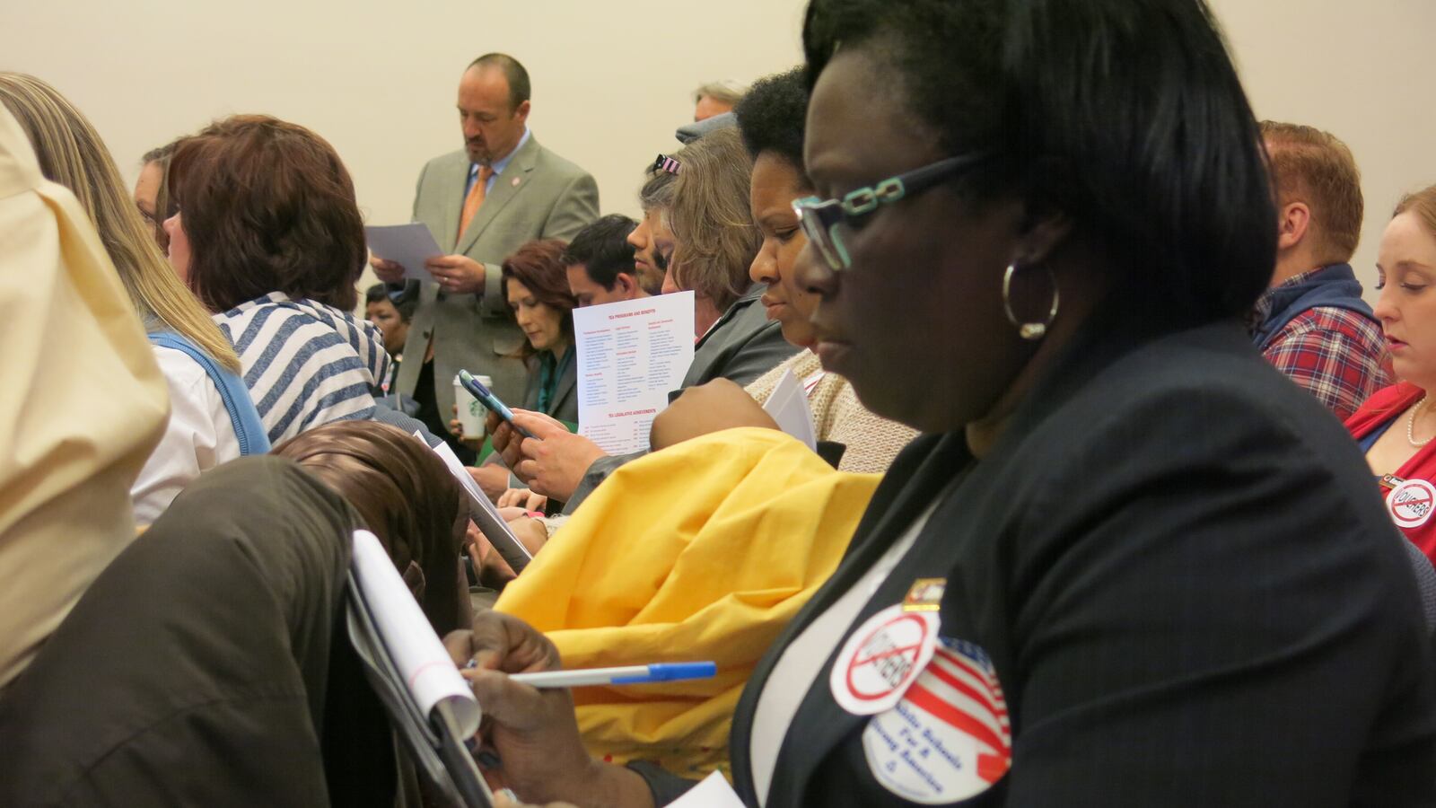 Teachers on spring break fill a legislative committee room Tuesday at the State Capitol to voice opposition to school vouchers.