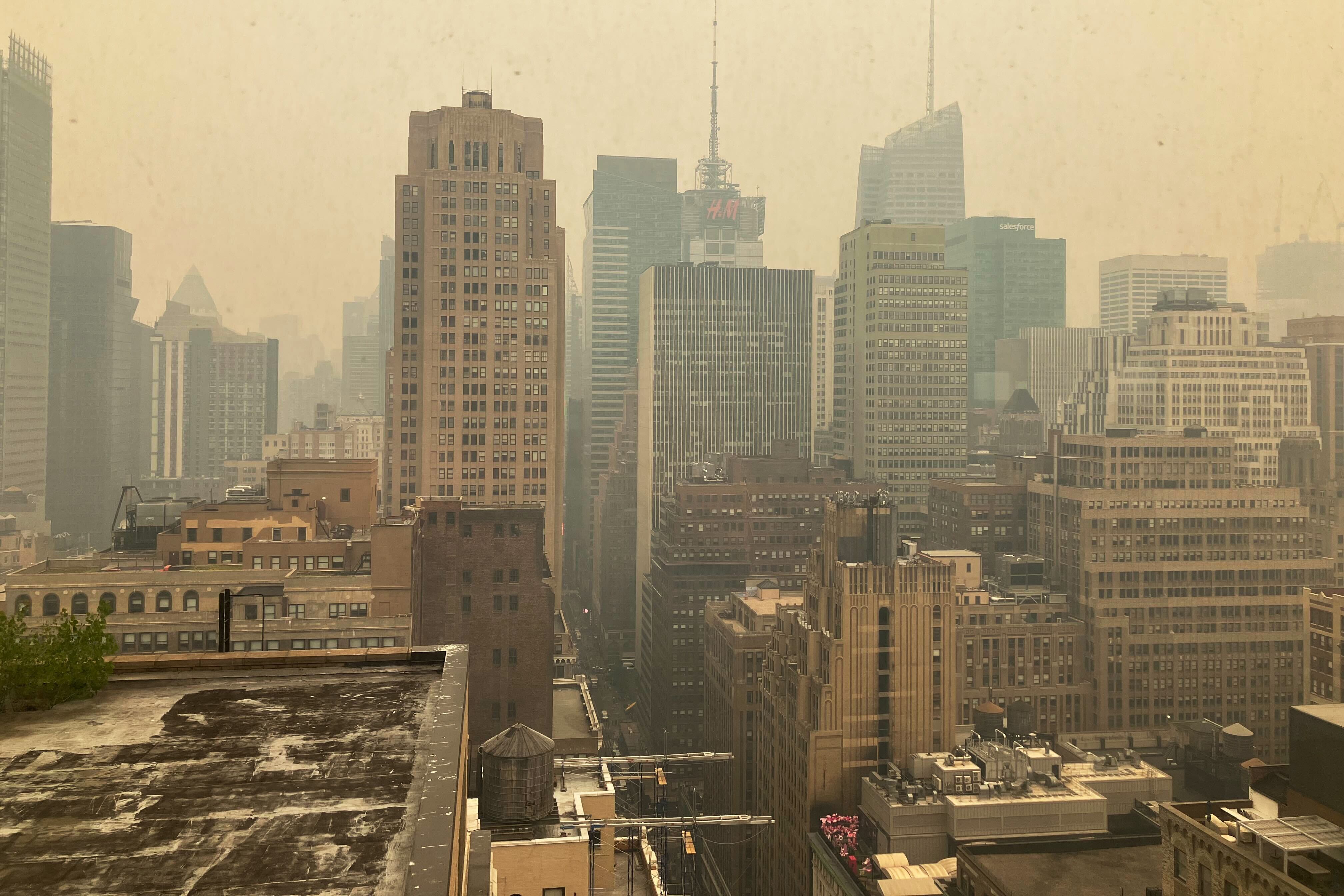 The Midtown Manhattan skyline looks yellowish-brown because of air quality issues.