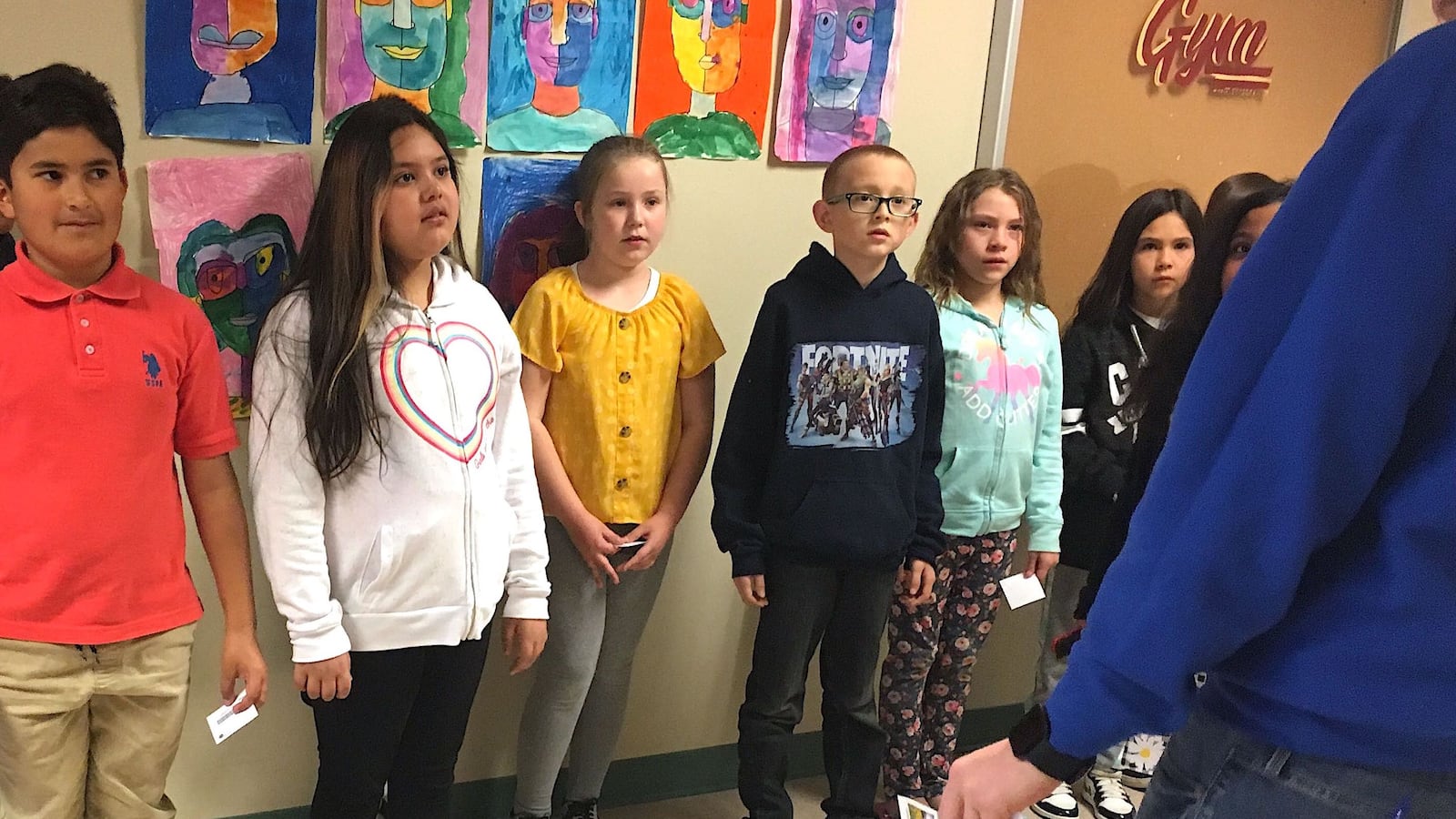 Fourth-grade students wait in the hallway at Stevens Elementary School in Wheat Ridge.