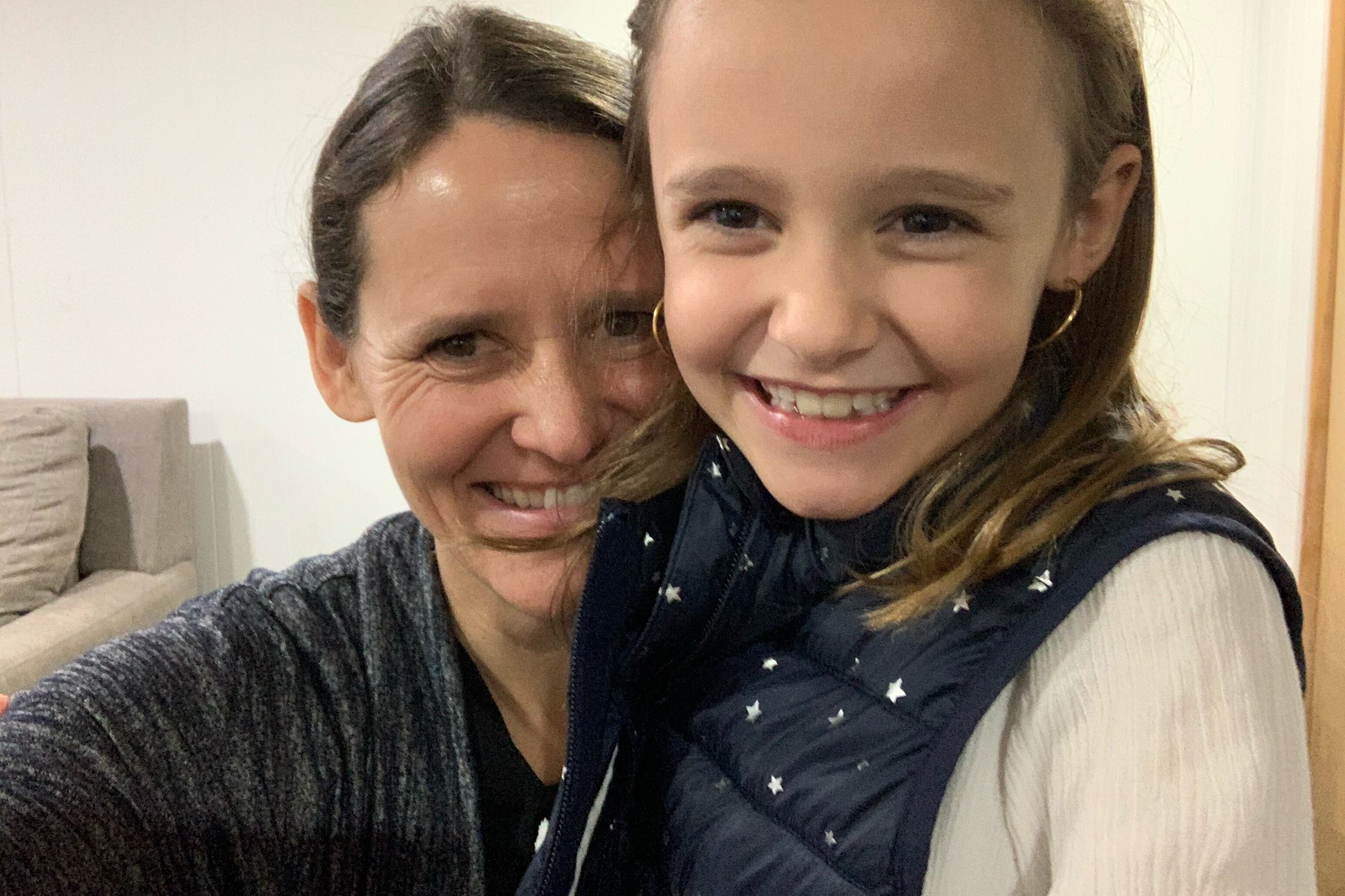 Mother Amy Janssens smiles with daughter Maeve, 8.