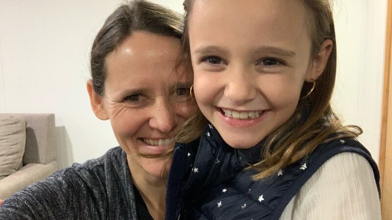 Mother Amy Janssens smiles with daughter Maeve, 8.