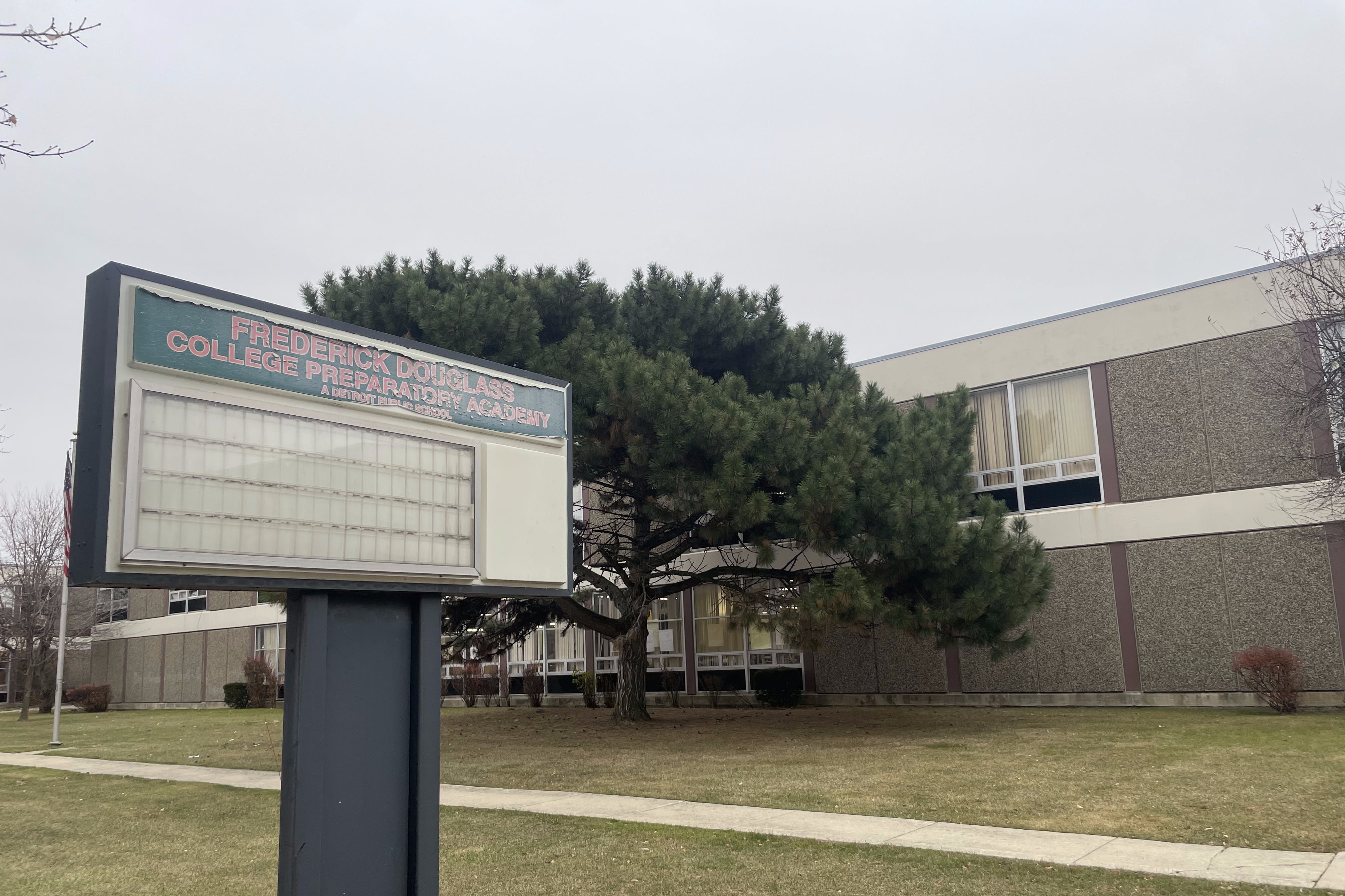 A sign in front of a building.
