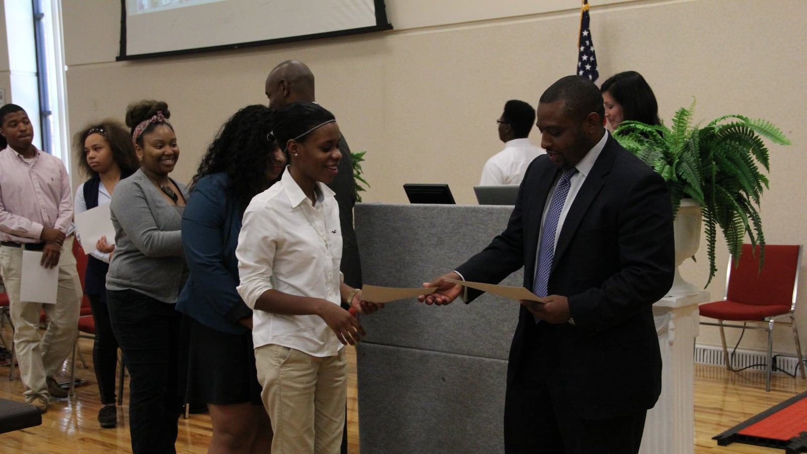 Memphis students receive congratulations Thursday from Shelby County Schools board member Kevin Woods after earning an IT certification following a summer learning program.