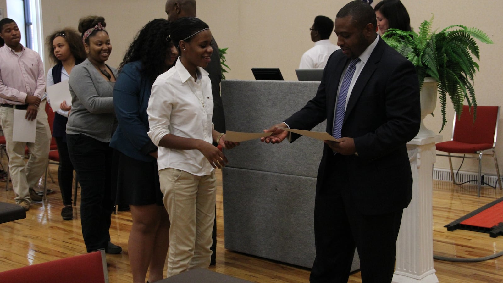 Memphis students receive congratulations Thursday from Shelby County Schools board member Kevin Woods after earning an IT certification following a summer learning program.