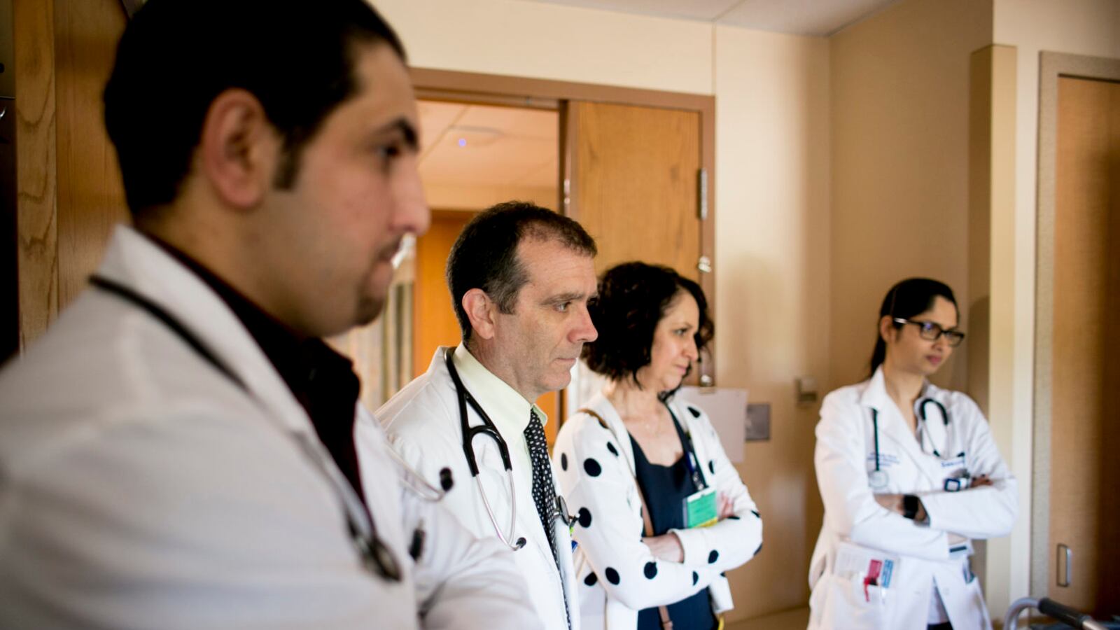 Elizabeth Moje, the dean of the school of education at the University of Michigan joins a resident, an intern and a medical student as they meet with a patient at Beaumont Hospital – Dearborn. A school she’s developing will similarly create ways for teachers to learn from peers a year or two ahead of them.