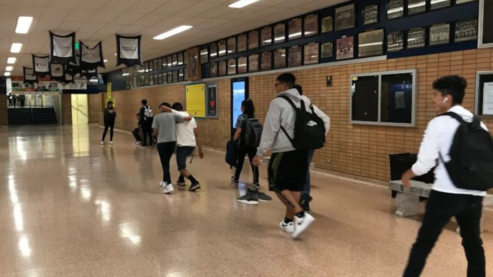 Students walk down the hallway at Denver's Abraham Lincoln High School in August 2019.