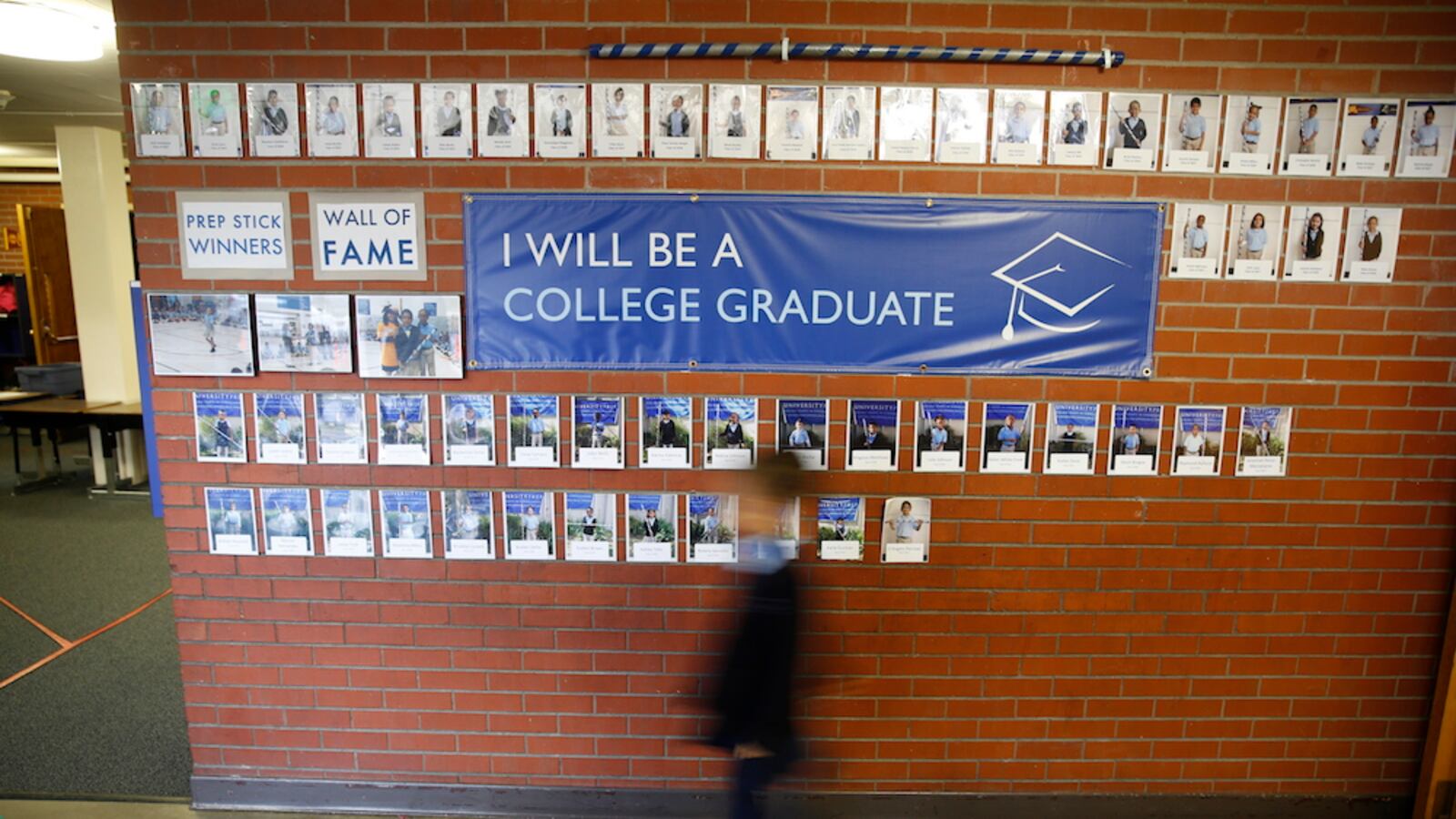 A student walks through the hallway of a Denver charter school.