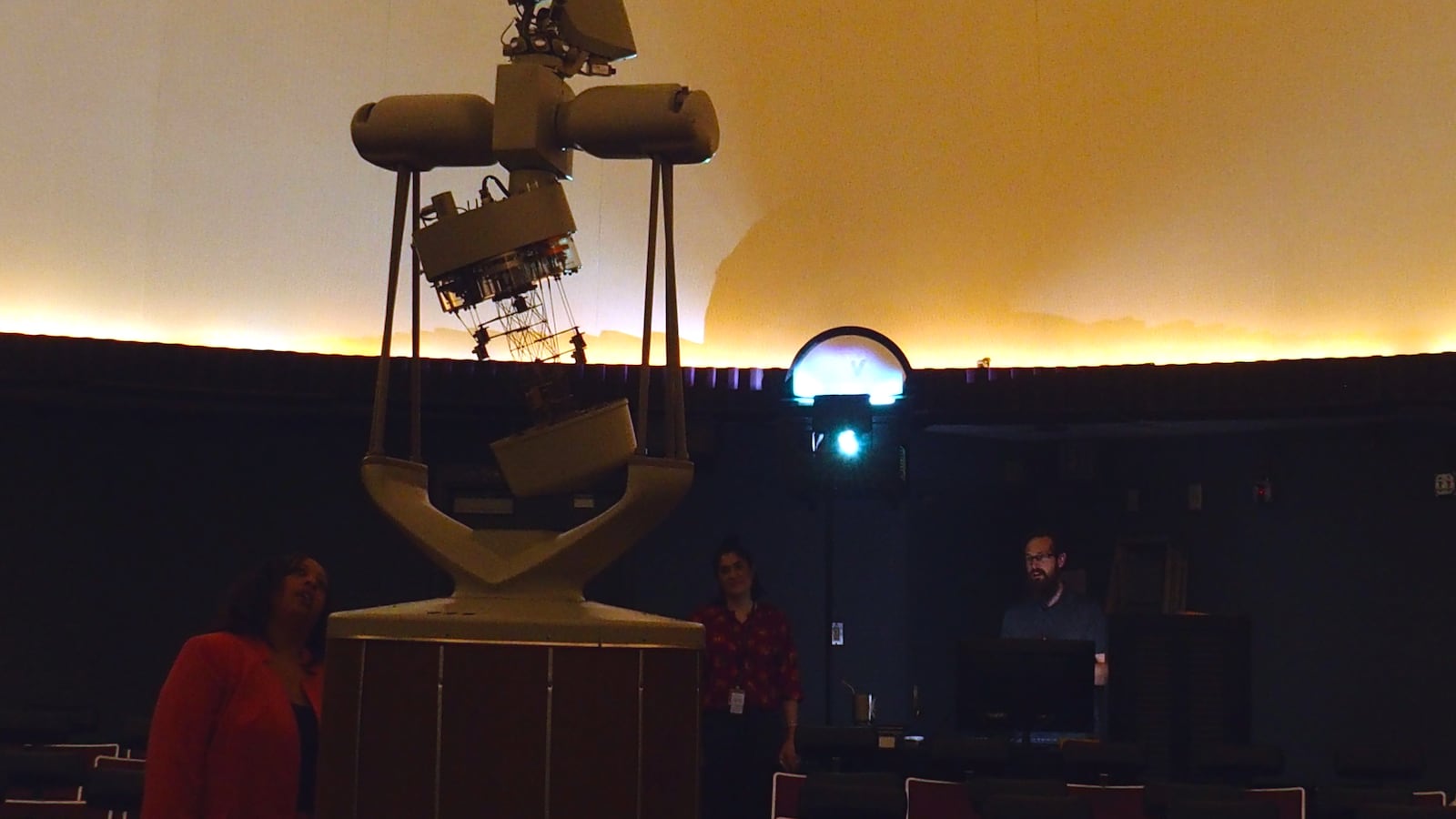 Principal Tisha Durrah, left, inspects a part of the planetarium that projects constellations and planets onto the large white dome screen at Craigmont High School.