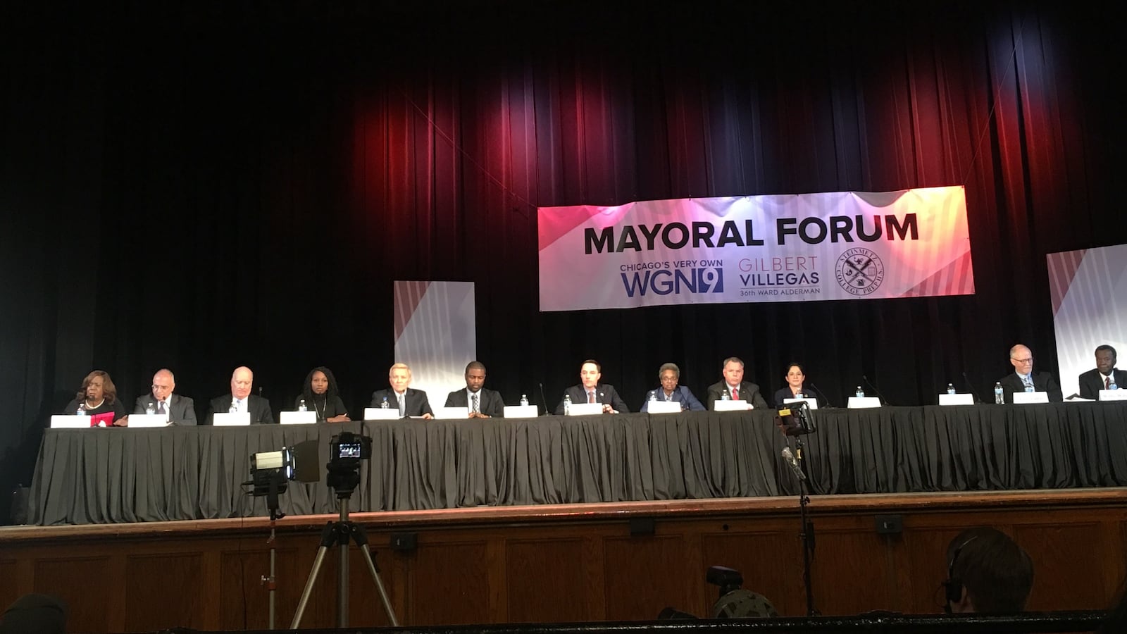 Mayoral candidates face off at Steinmetz High School during a candidate's forum.