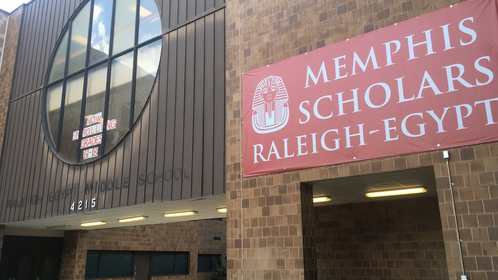 The new sign for Memphis Scholars Raleigh-Egypt is hung near the faded letters of the school’s former middle school name under Shelby County Schools.