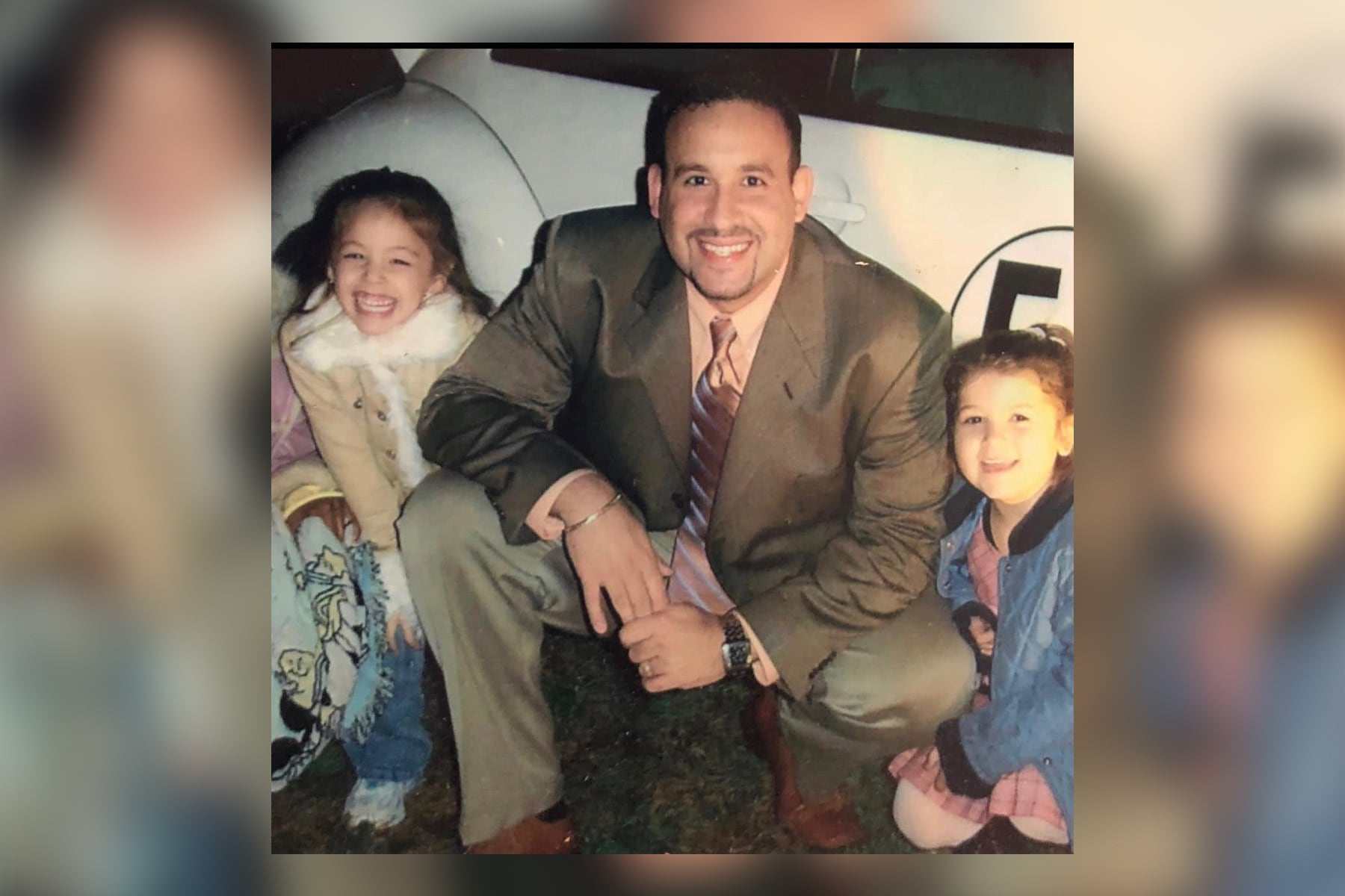 Education Secretary nominee Miguel Cardona pictured in November 2004 with two students during his time as principal of Hanover Elementary in Meriden, Connecticut.