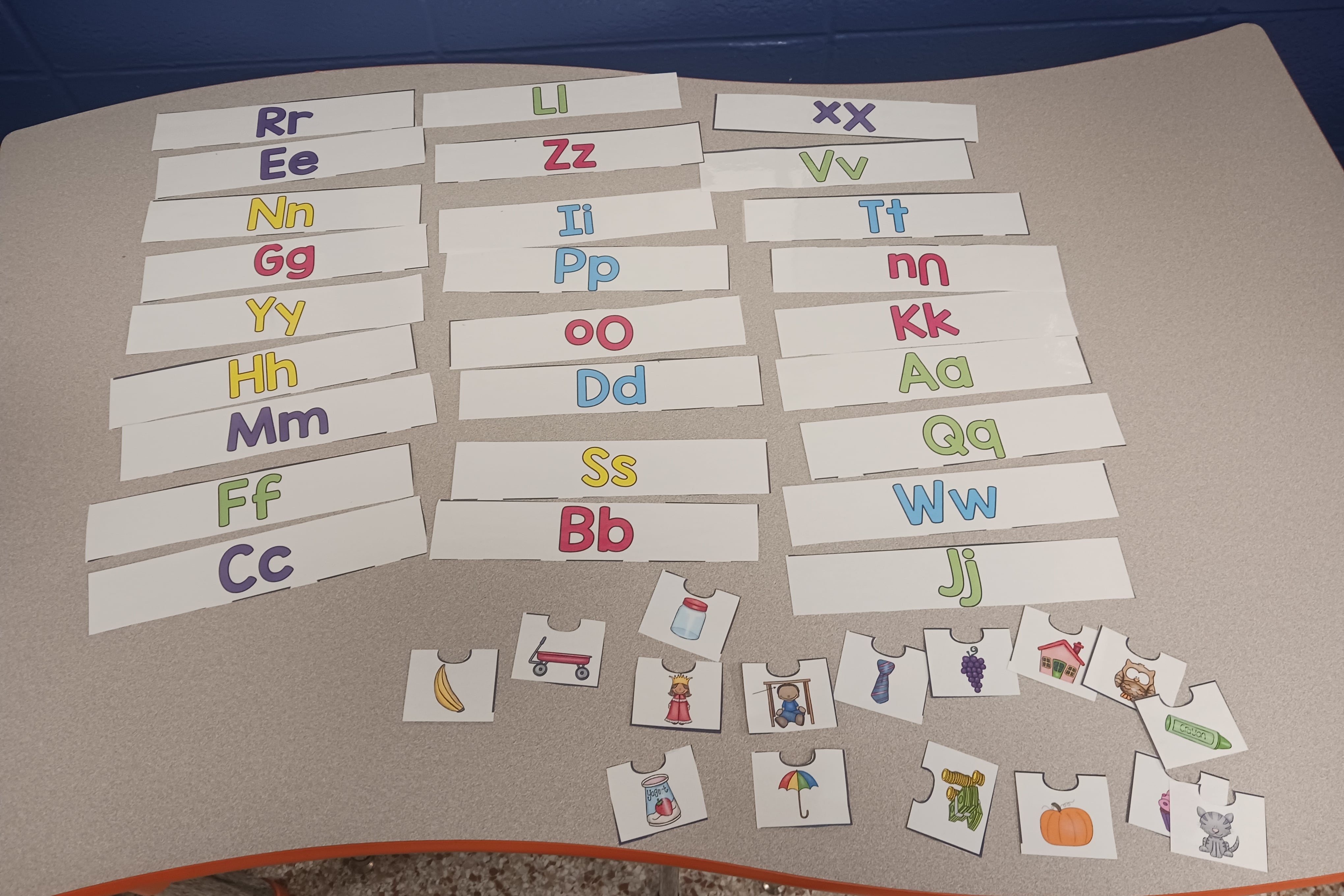 letter flashcards on a table