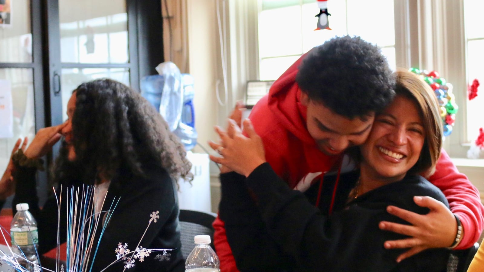 Fordham Leadership Academy Principal Fiorella Cabrejos celebrates with student Jasiel Nuñez after learning they are advancing to the next round of a competition to open or overhaul 40 schools.